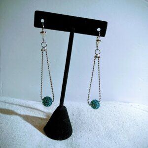 Turquoise color crystal drop pierced earrings.